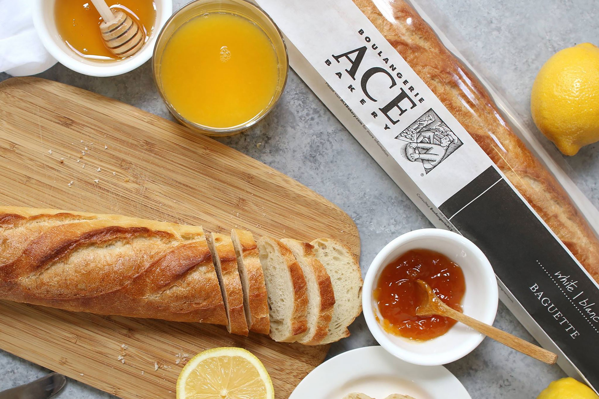White baguette on a cutting board by ACE Bakery