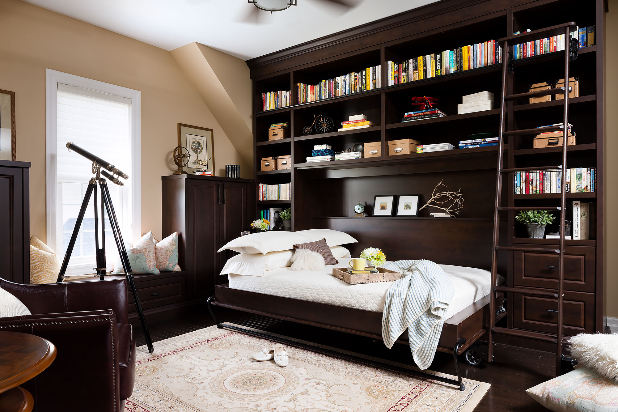Wall bed and bookshelf by Organized Interiors
